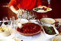 Serving Feijoada. Copyright Sheila Thomson. All rights reserved.