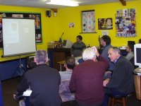 Members watch the scanning presentation.