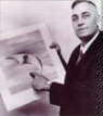 Photograph of Kenneth Arnold with a drawing of crescent-shaped craft